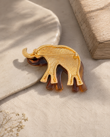 Back view of amber elephant brooch with gold-tone pin hardware