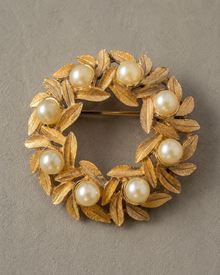Vintage Avon gold-tone faux pearl wreath brooch front view