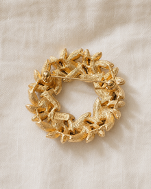 Back view of vintage Avon wreath brooch with signed mark