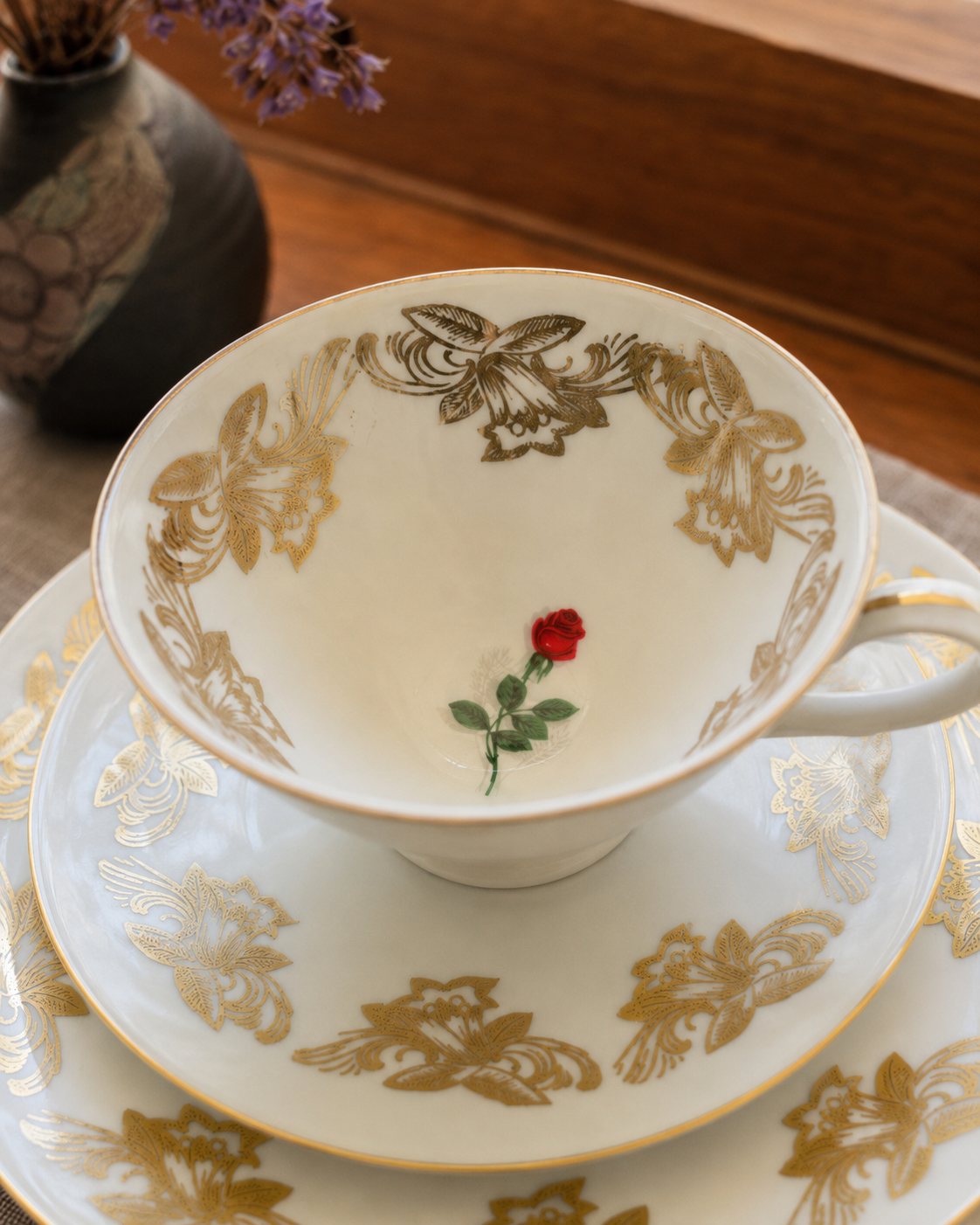 Bareuther gold rose porcelain teacup trio with cup and saucers