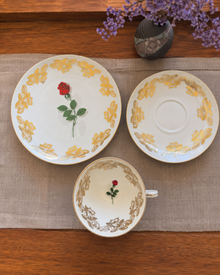 Top view of Bareuther gold rose teacup trio with dessert plate
