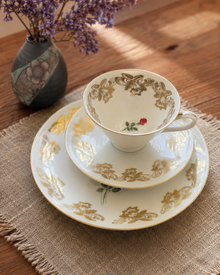 Bareuther porcelain teacup trio with gold floral decoration