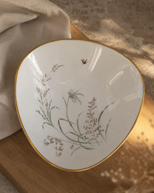 Top view of the Bavarian porcelain bowl on warm wood