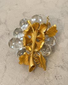 Back view of crystal-look grape cluster brooch with pin structure