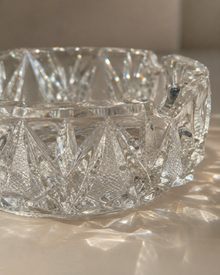 Side view of vintage cut crystal ashtray in sunlight