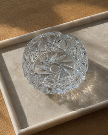 Close detail of cut crystal ashtray faceted pattern
