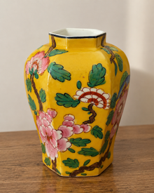 Yellow hand-painted ceramic vase with pink flowers and green leaves