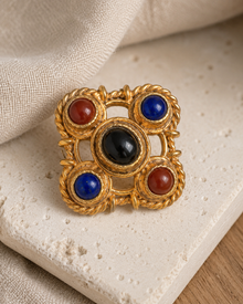 Close front view of a gem-tone clip earring