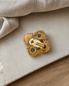 Back view of a gem-tone clip earring with clip hardware