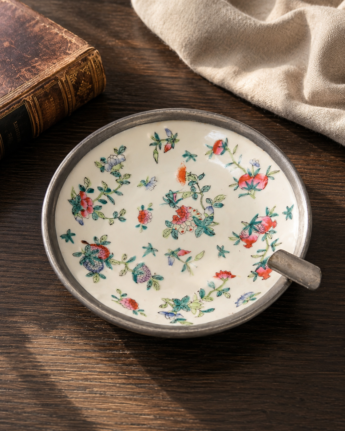 Japanese porcelain catchall with floral painting and silver-tone rim